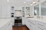 Gorgeous eat-in kitchen is fully stocked with all the amenities 